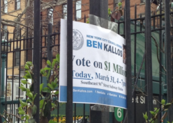 Sign for participatory budgeting taped to a fence in Manhattan